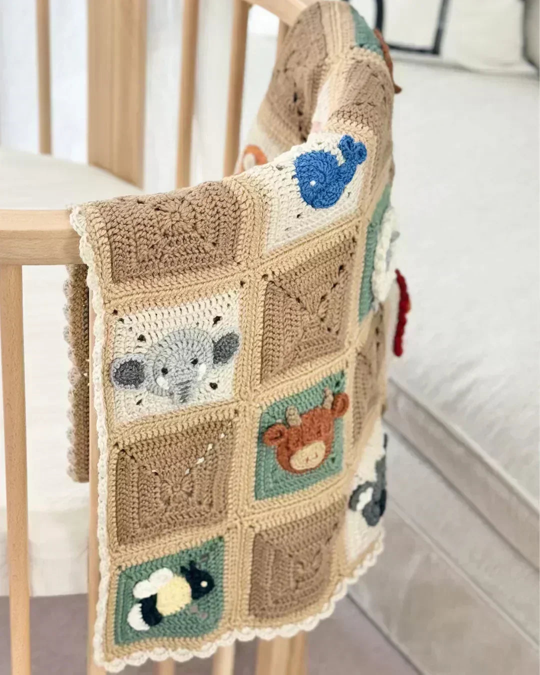 Handmade baby blanket with 20 colorful animal granny squares