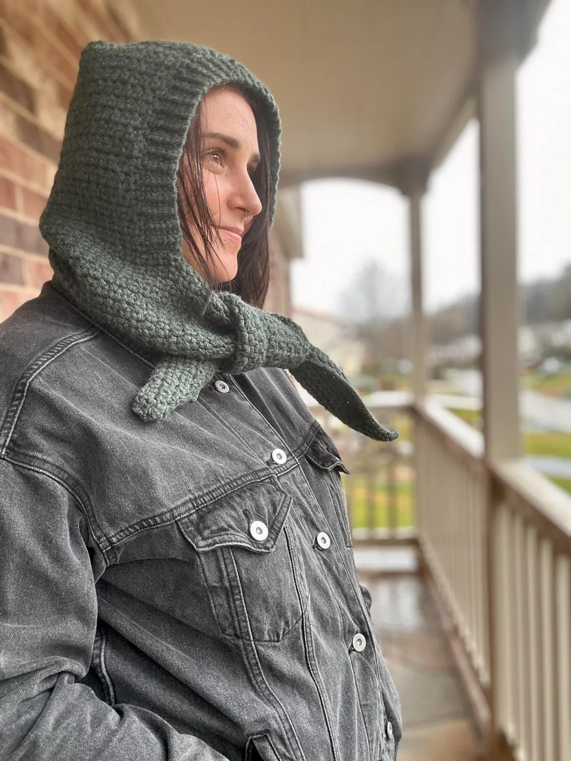 Female model wearing soft crochet hood made from Sophie Hood pattern – winter-ready look.