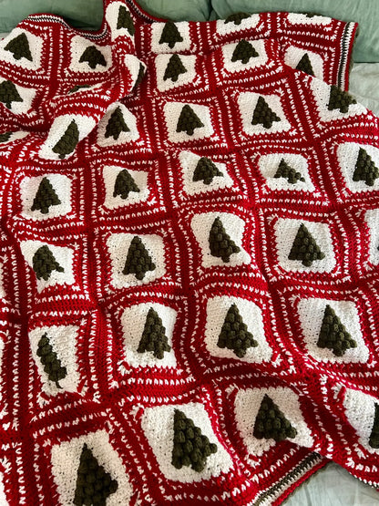 Close-up of green and red granny squares from the Christmas Tree crochet pattern.