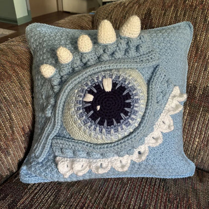 fantasy themed crochet eye dragon pillow home decoration on a sofa