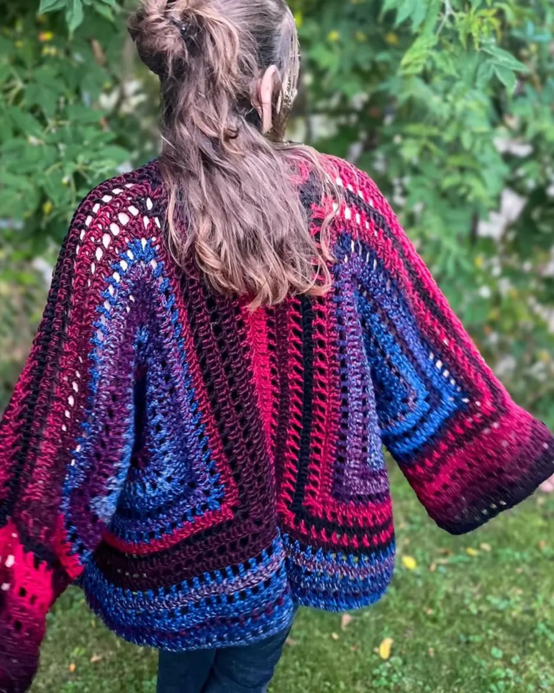 Handmade crochet cardigan worn by a girl outdoors