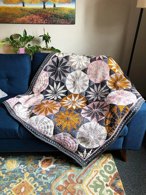 Marguerite blanket crochet pattern with floral geometric design