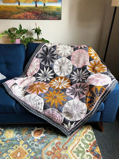 Marguerite blanket crochet pattern with floral geometric design