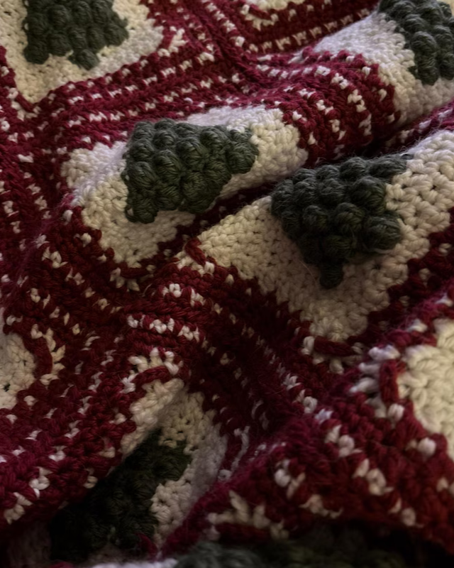 Close-up of green and red granny squares from the Christmas Tree crochet pattern.